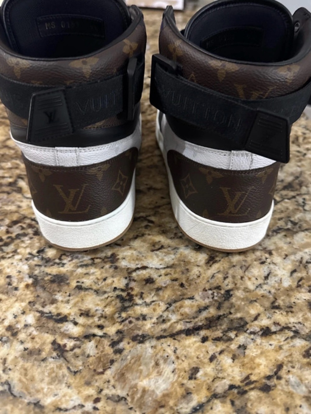 Louis Vuitton Black High Top Sneakers with Gold Accents